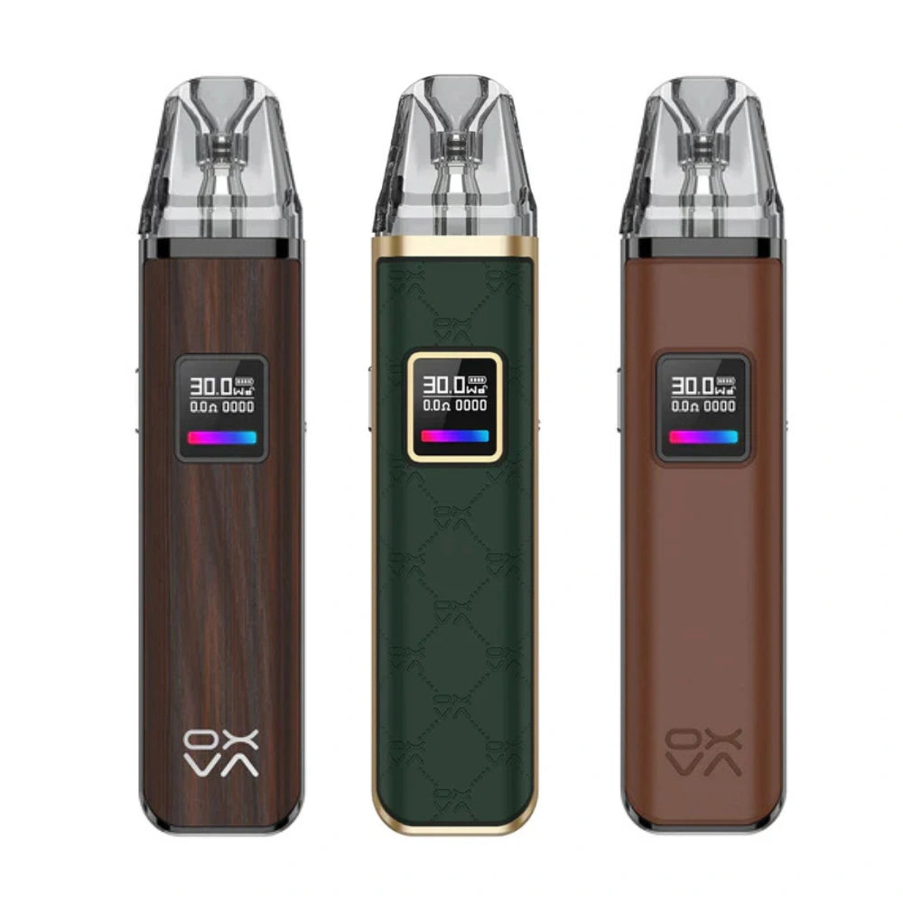 Oxva Xlim Pro Pod Kit collection showcasing three stylish designs including wood, green leather, and brown leather finish – compact pod kits with LED screen, adjustable wattage, and modern vape technology.